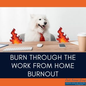 dog sitting at a desk with flames